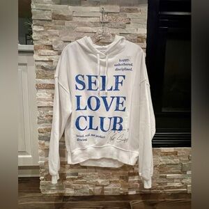 Women’s hoodie sweatshirt. Self love club. Size small.
